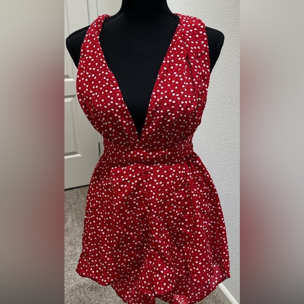 Versatile romper, red and white hearts size 4.